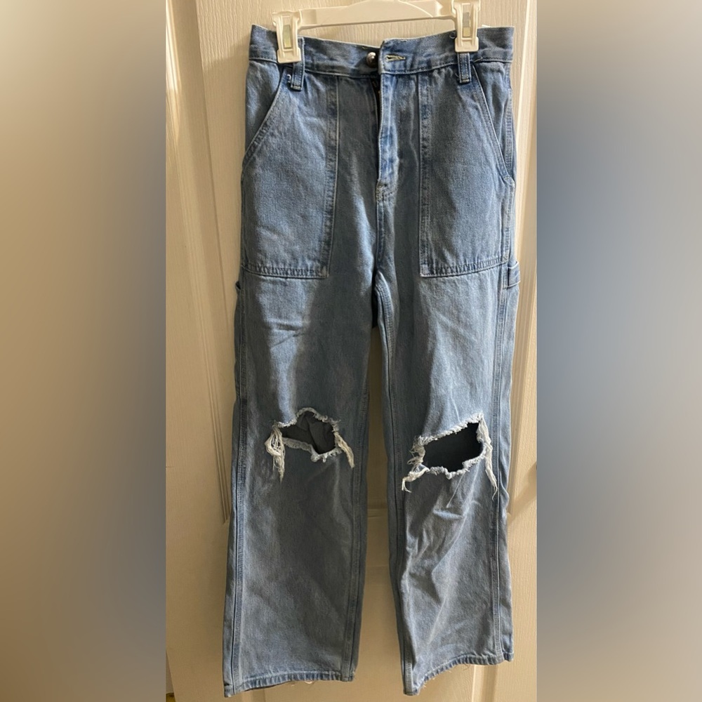 Women’s size 0 Jean cargo pants. Distressed/open at the knees.